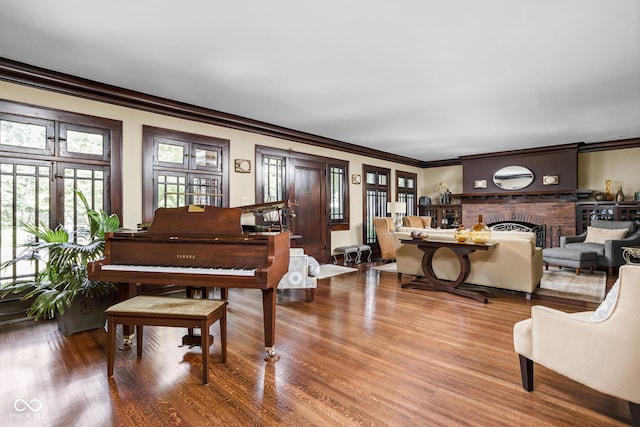 4455 Broadway St, Indianapolis, IN 46205 - living area featuring crown molding, wood finished floors, and a fireplace