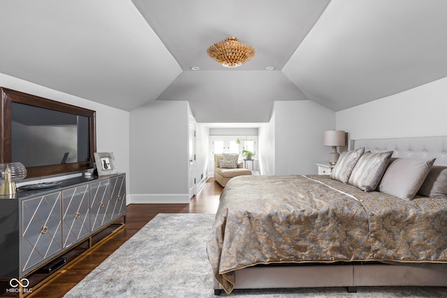 4455 Broadway St, Indianapolis, IN 46205 - bedroom featuring dark wood-type flooring and vaulted ceiling