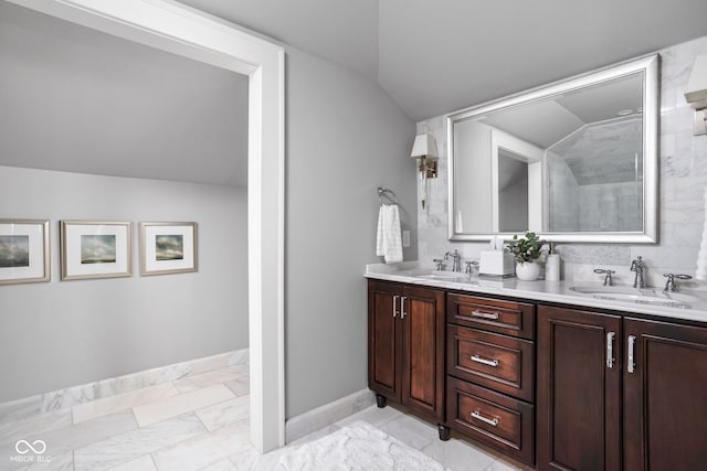 4455 Broadway St, Indianapolis, IN 46205 - bathroom with marble finish flooring, vaulted ceiling, and double vanity