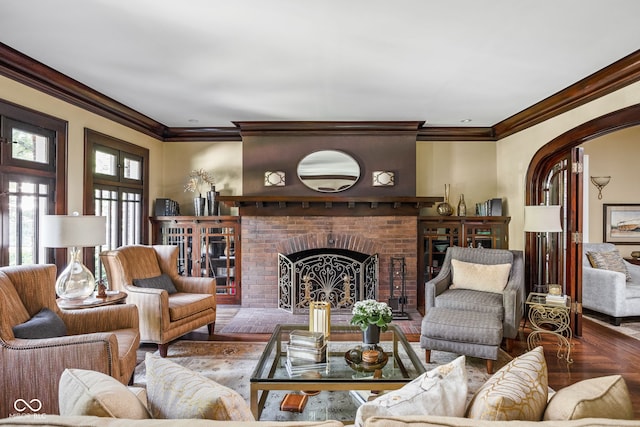 4455 Broadway St, Indianapolis, IN 46205 - living area with crown molding, arched walkways, a fireplace, and wood finished floors
