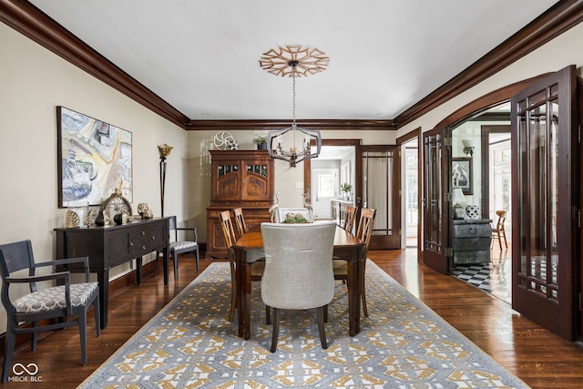 4455 Broadway St, Indianapolis, IN 46205 - dining area featuring a chandelier, crown molding, and dark wood finished floors