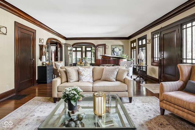 4455 Broadway St, Indianapolis, IN 46205 - living area featuring healthy amount of natural light, wood finished floors, arched walkways, and crown molding
