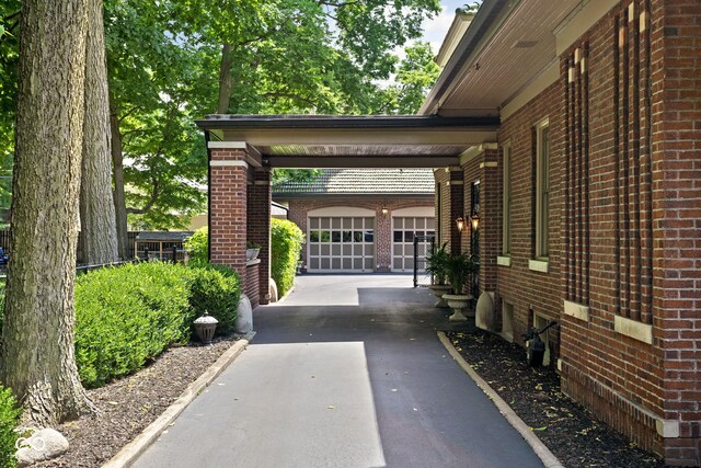 4455 Broadway St, Indianapolis, IN 46205 - view of vehicle parking featuring driveway and a garage