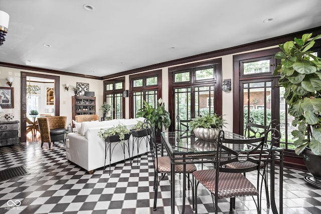 4455 Broadway St, Indianapolis, IN 46205 - living area with crown molding, french doors, and tile patterned floors