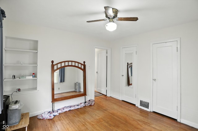 95 S 11th Ave, Beech Grove, IN 46107 - unfurnished bedroom featuring wood finished floors and ceiling fan
