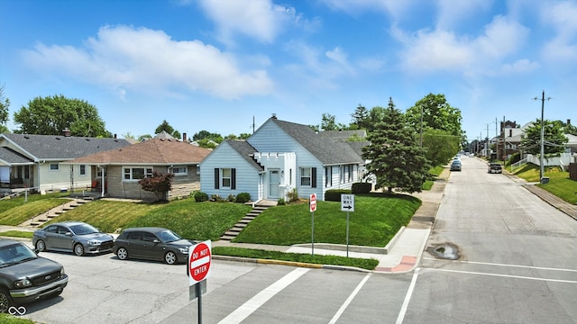 95 S 11th Ave, Beech Grove, IN 46107 - view of front of home featuring a front yard and uncovered parking