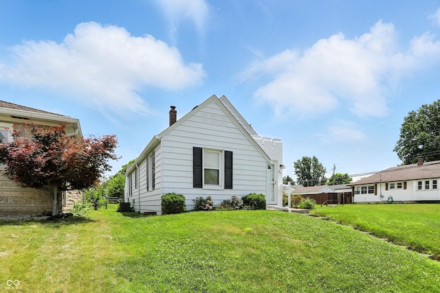 95 S 11th Ave, Beech Grove, IN 46107 - view of front of home featuring a chimney and a front lawn