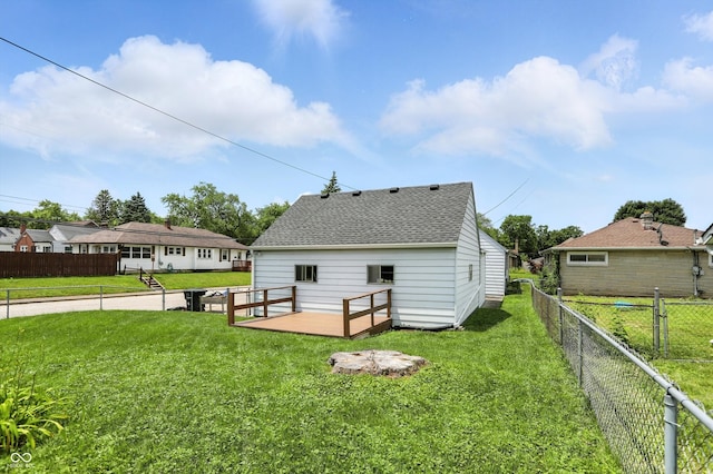 95 S 11th Ave, Beech Grove, IN 46107 - rear view of house featuring a shingled roof and a wooden deck