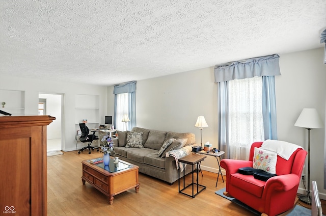 95 S 11th Ave, Beech Grove, IN 46107 - living area featuring a textured ceiling, wood finished floors, and an office area
