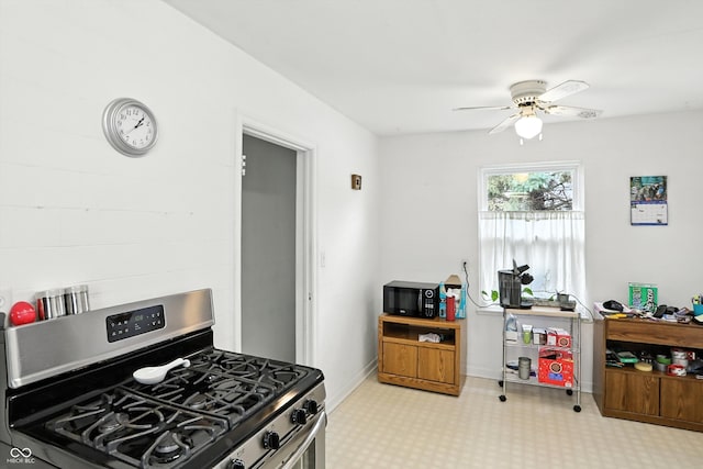 95 S 11th Ave, Beech Grove, IN 46107 - kitchen featuring stainless steel gas range oven, black microwave, ceiling fan, and carpet floors