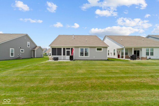 19959 Cowie Ln, Westfield, IN 46074 - back of property featuring a patio, a sunroom, and a lawn