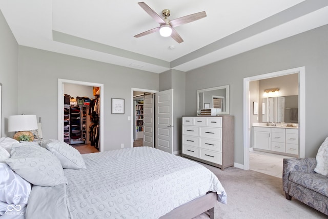 19959 Cowie Ln, Westfield, IN 46074 - bedroom featuring a raised ceiling, a walk in closet, ensuite bathroom, a closet, and ceiling fan