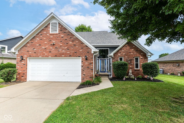 662 Leah Way, Greenwood, IN 46142 - traditional-style home featuring brick siding, a front lawn, and concrete driveway