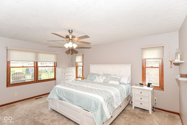 662 Leah Way, Greenwood, IN 46142 - bedroom featuring light colored carpet, a ceiling fan, and a textured ceiling