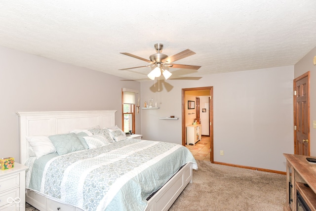 662 Leah Way, Greenwood, IN 46142 - bedroom featuring light carpet, ceiling fan, and a textured ceiling