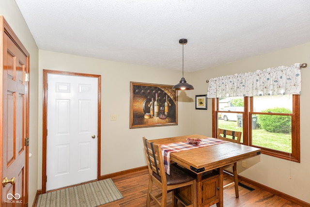 662 Leah Way, Greenwood, IN 46142 - dining space with wood finished floors and a textured ceiling