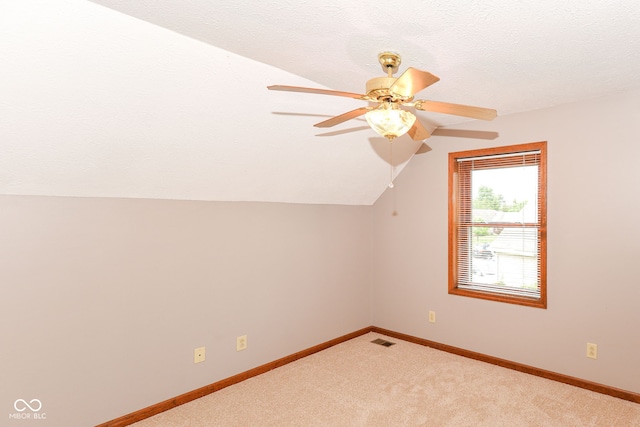 662 Leah Way, Greenwood, IN 46142 - bonus room featuring lofted ceiling, light carpet, ceiling fan, and a textured ceiling