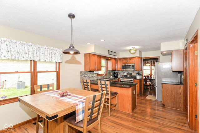 662 Leah Way, Greenwood, IN 46142 - dining room featuring dark wood finished floors and a textured ceiling
