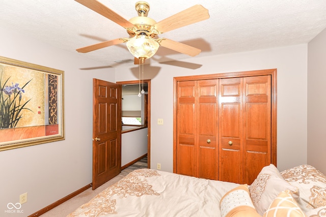 662 Leah Way, Greenwood, IN 46142 - bedroom with a closet, carpet flooring, a ceiling fan, and a textured ceiling