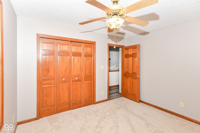 662 Leah Way, Greenwood, IN 46142 - unfurnished bedroom featuring carpet flooring, a closet, ceiling fan, and a textured ceiling