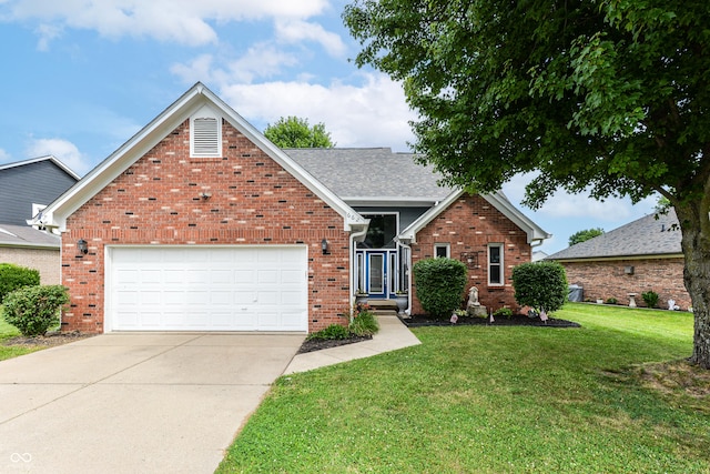 662 Leah Way, Greenwood, IN 46142 - traditional-style home with brick siding, a front lawn, driveway, and a garage