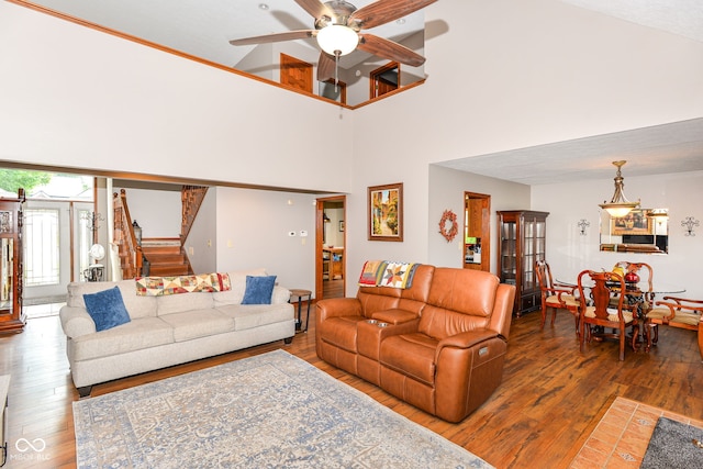 662 Leah Way, Greenwood, IN 46142 - living area with hardwood / wood-style flooring, ceiling fan, stairway, and a high ceiling