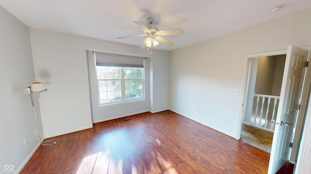 2259 Colfax Ln Unit 2259, Indianapolis, IN 46260 - empty room featuring a ceiling fan, wood finished floors, and a smoke detector