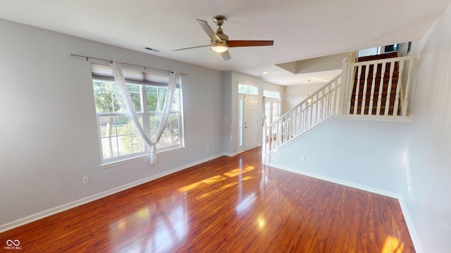 2259 Colfax Ln Unit 2259, Indianapolis, IN 46260 - unfurnished room with a ceiling fan, stairs, and wood finished floors