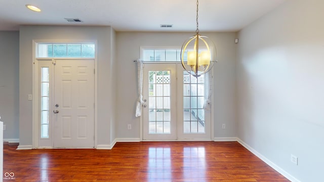 2259 Colfax Ln Unit 2259, Indianapolis, IN 46260 - foyer entrance with a chandelier, wood finished floors, and recessed lighting