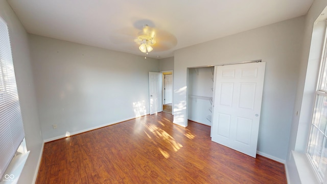 2259 Colfax Ln Unit 2259, Indianapolis, IN 46260 - unfurnished bedroom featuring wood finished floors, a closet, and ceiling fan