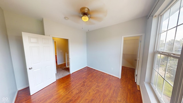 2259 Colfax Ln Unit 2259, Indianapolis, IN 46260 - empty room with wood finished floors, a ceiling fan, and a smoke detector