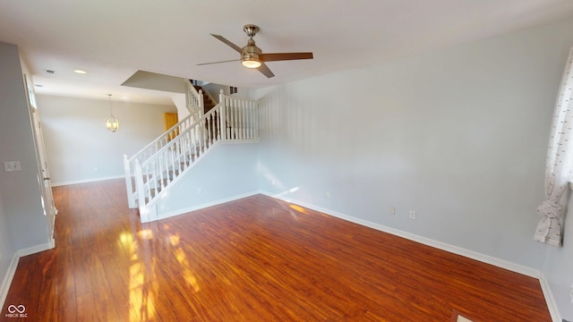 2259 Colfax Ln Unit 2259, Indianapolis, IN 46260 - unfurnished living room featuring stairs, wood finished floors, ceiling fan, and recessed lighting