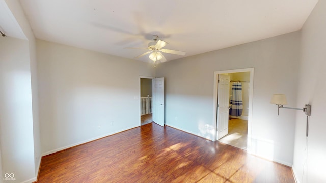 2259 Colfax Ln Unit 2259, Indianapolis, IN 46260 - unfurnished bedroom featuring wood finished floors and a ceiling fan