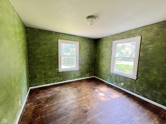 1601 E 44th St, Indianapolis, IN 46205 - spare room with wood finished floors and baseboards
