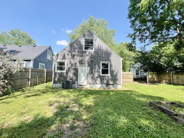 1601 E 44th St, Indianapolis, IN 46205 - rear view of property with a fenced backyard and a vegetable garden