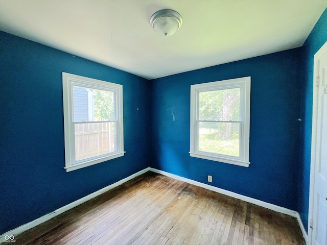1601 E 44th St, Indianapolis, IN 46205 - unfurnished room featuring plenty of natural light and wood-type flooring