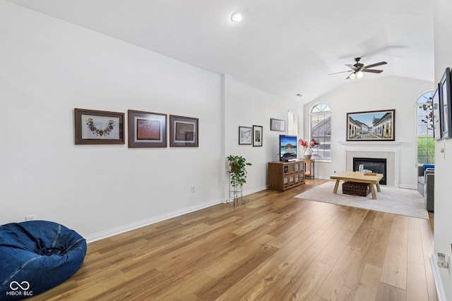 16636 Brownstone Ct, Westfield, IN 46074 - living area with light wood-style floors, a ceiling fan, a glass covered fireplace, lofted ceiling, and recessed lighting