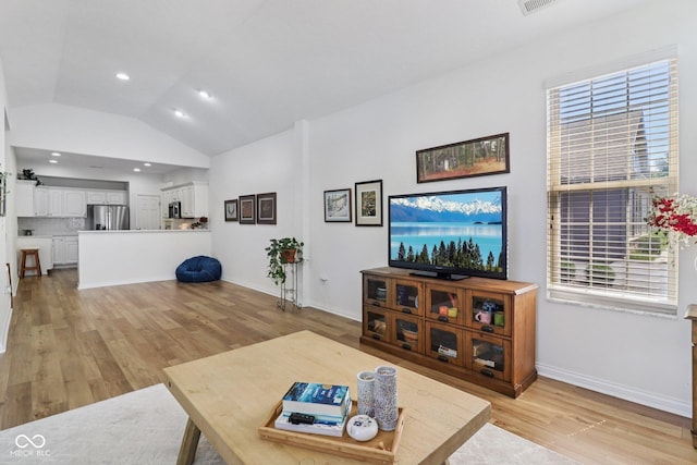 16636 Brownstone Ct, Westfield, IN 46074 - living area with light wood-style floors, lofted ceiling, healthy amount of natural light, and recessed lighting