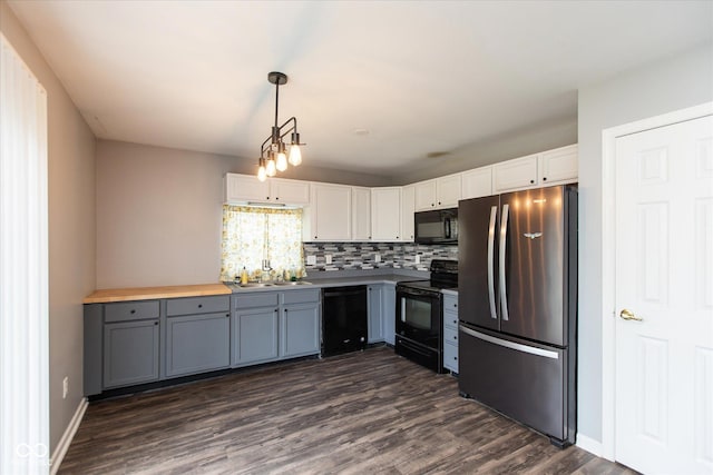 142 Hilltop Farms Blvd, Whiteland, IN 46184 - kitchen featuring black appliances, dark wood-type flooring, white cabinets, gray cabinets, and pendant lighting