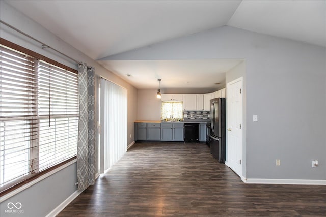 142 Hilltop Farms Blvd, Whiteland, IN 46184 - kitchen with black appliances, lofted ceiling, dark wood finished floors, decorative backsplash, and pendant lighting
