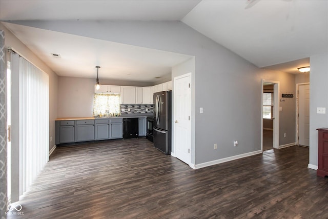 142 Hilltop Farms Blvd, Whiteland, IN 46184 - kitchen featuring freestanding refrigerator, healthy amount of natural light, dark wood-type flooring, pendant lighting, and vaulted ceiling