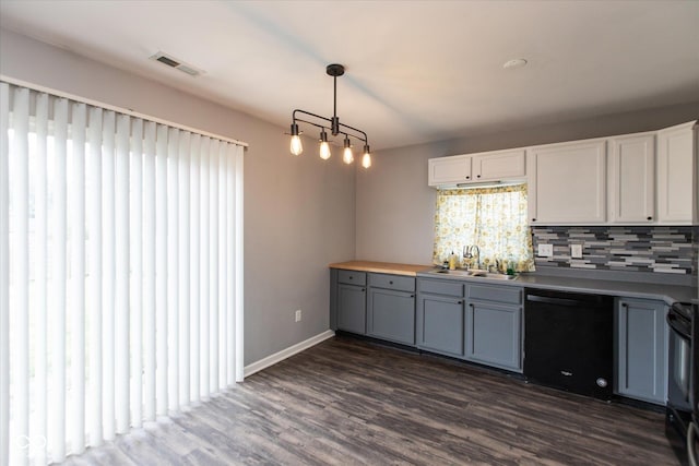 142 Hilltop Farms Blvd, Whiteland, IN 46184 - kitchen featuring dishwasher, decorative backsplash, gray cabinetry, dark wood finished floors, and decorative light fixtures