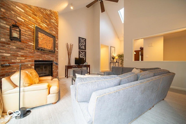 8550 Tidewater Ct, Indianapolis, IN 46236 - living room featuring carpet, ceiling fan, a brick fireplace, a skylight, and high vaulted ceiling