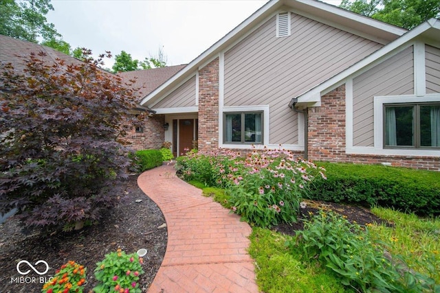 8550 Tidewater Ct, Indianapolis, IN 46236 - doorway to property featuring brick siding