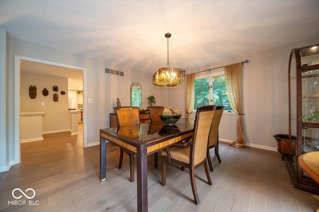 8550 Tidewater Ct, Indianapolis, IN 46236 - dining room featuring a chandelier and wood-type flooring