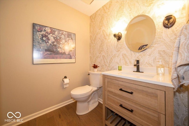 8550 Tidewater Ct, Indianapolis, IN 46236 - bathroom with wallpapered walls, wood finished floors, and vanity