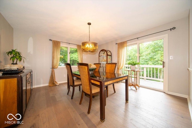 8550 Tidewater Ct, Indianapolis, IN 46236 - dining room featuring wood-type flooring and a chandelier