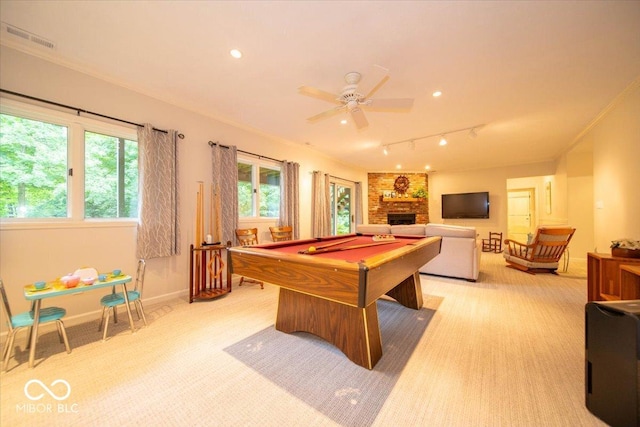 8550 Tidewater Ct, Indianapolis, IN 46236 - rec room featuring pool table, light carpet, track lighting, a large fireplace, and ceiling fan