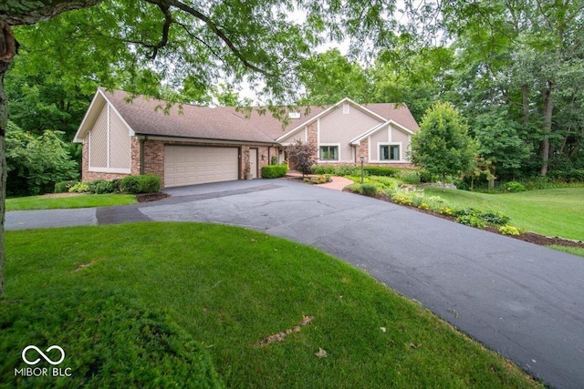 8550 Tidewater Ct, Indianapolis, IN 46236 - mid-century inspired home featuring driveway, a garage, a front lawn, and brick siding