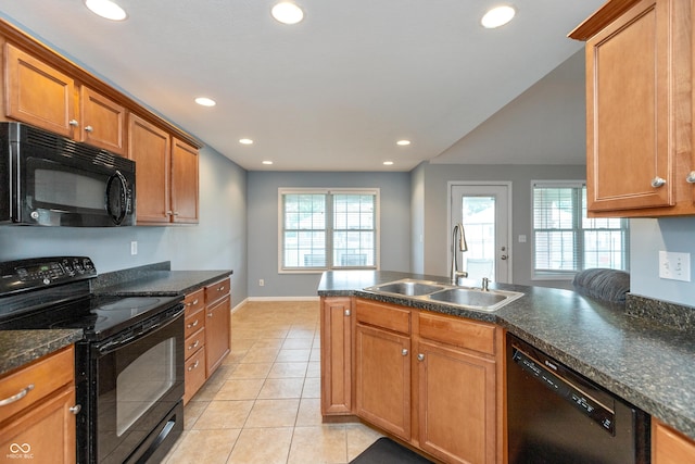1977 Sophia Ln, Seymour, IN 47274 - kitchen with black appliances, recessed lighting, light tile patterned floors, brown cabinetry, and a peninsula